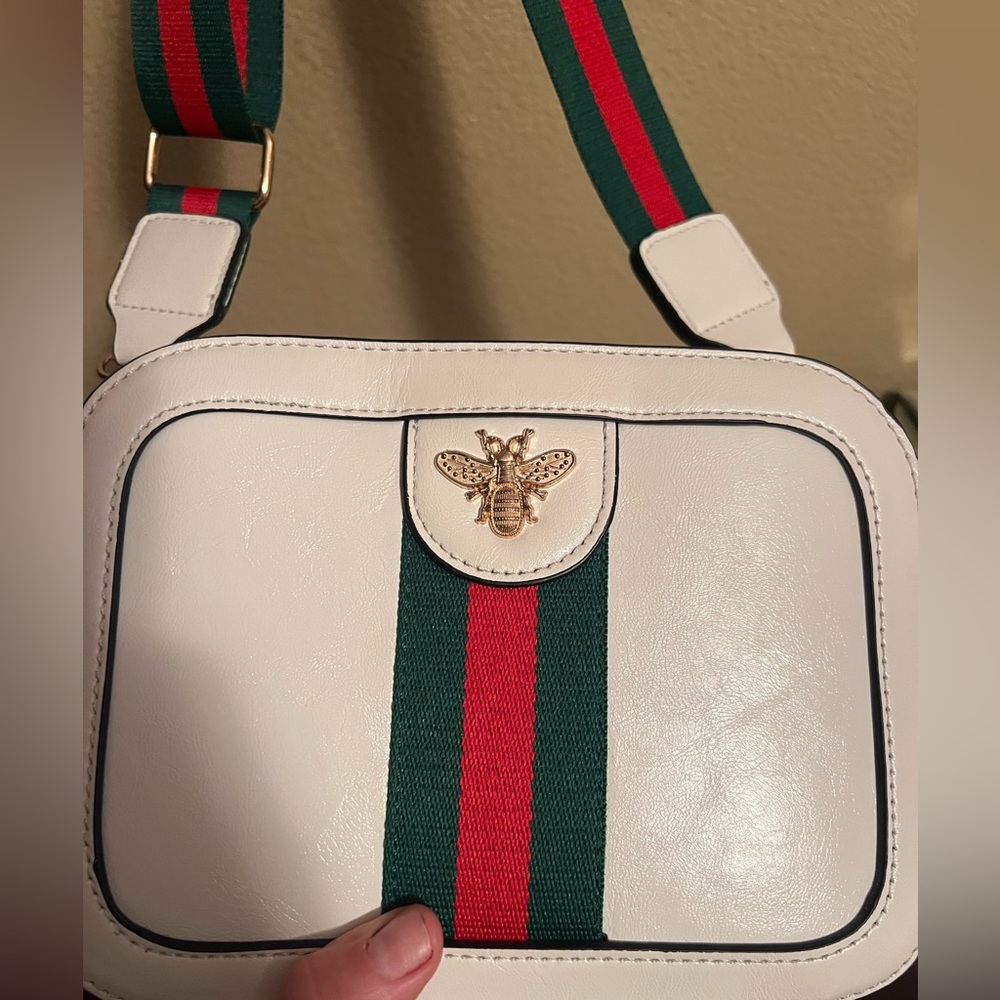Designer inspired crossbody bag. White with green and red adjustable strap